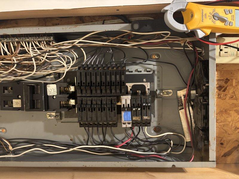Responded to no cooling call on AC unit that would not turn on. Upon arrival, inspected electrical panel and contactor assembly in attic location. Tested electrical connections and circuit breakers using clamp meter to diagnose power supply issues. Found faulty contactor preventing compressor from engaging. Verified proper voltage at panel, checked all associated wiring connections, and confirmed circuit breaker functionality. Replaced defective contactor, restored power to unit, and verified system operation. Unit now cooling properly with all electrical components functioning as designed.