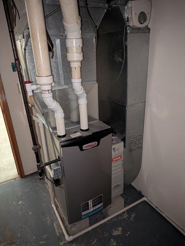 Completed AC super tune-up on 32-year-old system. During inspection, discovered unit was completely out of refrigerant. Tagged equipment with red notice indicating "AC out of refrigerant" and "Do NOT Turn on" to prevent compressor damage from operating without proper charge. System requires refrigerant recharge and leak detection before returning to service.