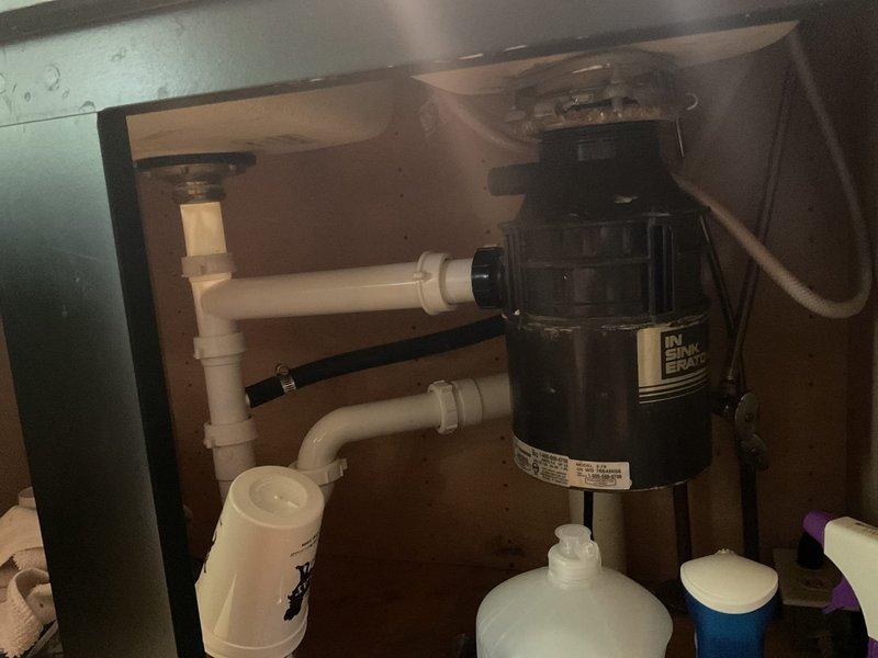 Responded to emergency call for toilet overflow with stuck valve and detached tap causing water discharge. Upon arrival, confirmed water supply had been shut off to prevent further flooding. Inspected plumbing system, replaced faulty valve mechanism, and securely reinstalled tap fixture. Restored water supply, tested system for proper operation and verified no leaks present. Documented completed repairs with photographs of plumbing configuration and under-sink area showing proper installation and system functionality.