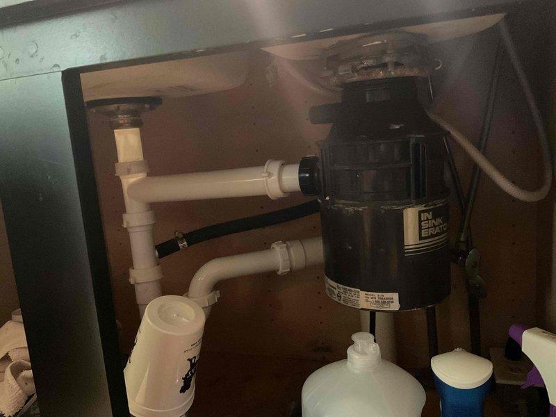 Responded to emergency call for toilet overflow with stuck valve and detached tap causing water discharge. Upon arrival, confirmed water supply had been shut off to prevent further flooding. Inspected plumbing system, replaced faulty valve mechanism, and securely reinstalled tap fixture. Restored water supply, tested system for proper operation and verified no leaks present. Documented completed repairs with photographs of plumbing configuration and under-sink area showing proper installation and system functionality.