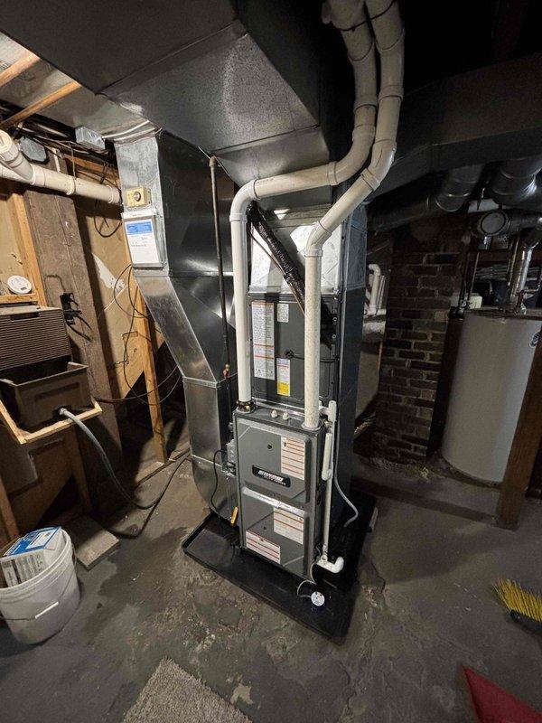 Completed full HVAC system installation including new furnace unit in basement and outdoor air conditioning condensing unit. Coordinated 100-amp electrical service upgrade with utility company power disconnect and reconnect, obtained electrical permit, and scheduled inspection. Installed furnace with proper intake/exhaust ductwork and PVC venting system, connected to existing ductwork infrastructure. Mounted AC condensing unit on concrete pad with appropriate electrical disconnect box and conduit. All installations completed to code specifications and passed inspection.