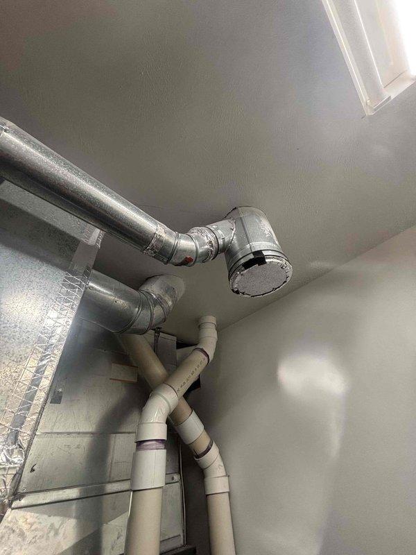 Completed annual cooling system maintenance inspection and tune-up service. Performed comprehensive AC system evaluation including refrigerant levels, electrical connections, and operational efficiency testing. Addressed customer inquiry regarding water heater anode rod replacement necessity, explaining the three-year service interval and benefits of preventative maintenance for the EnergiAir water heater unit installed in 2022 with warranty expiration in 2032. Documented existing conditions of HVAC ductwork, plumbing connections, and mechanical equipment installation through photographic records. All systems operating within normal parameters upon service completion.