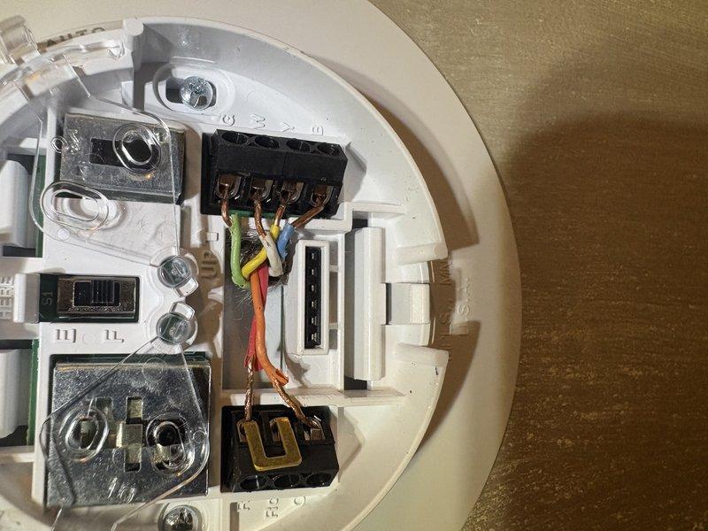 Responded to non-functioning 3-zone Trol-A-Temp damper system where customer had replaced original mercury thermostats with incompatible Honeywell 1-stage manual thermostats. Diagnosed improper thermostat wiring to 1998 zoning control board, preventing zone dampers from responding to individual setpoints. Rewired thermostat connections at zone control panel to restore proper communication between thermostats and Emerson zoning board, verified damper operation across all three zones, and confirmed system now responds correctly to individual zone calls for heating and cooling.