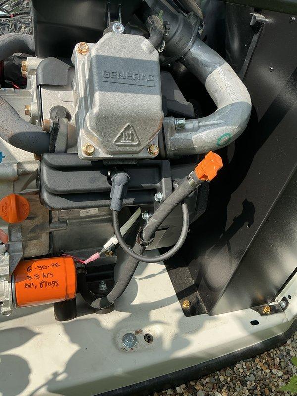 Completed comprehensive 5-year tune-up on Generac standby generator system. Performed oil and filter change, documented oil plug service with 2-hour runtime verification, and inspected all refrigerant lines, electrical connections, and mounting hardware. All components found in proper working condition with orange service tags applied indicating next maintenance due date of 6-30-26, and generator plan renewed through 2025.