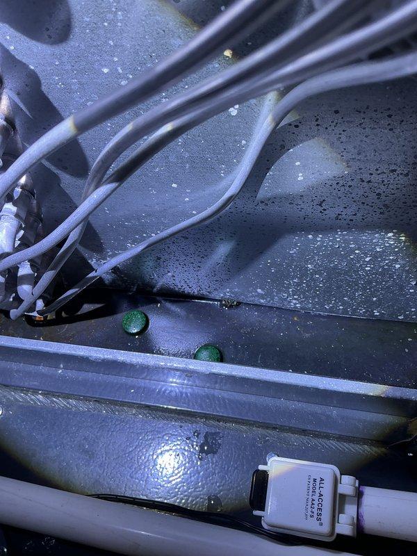 Completed annual cooling maintenance on 2016 EnergiAir system under 4-year warranty coverage. Performed comprehensive inspection of unit interior, noting normal condensation accumulation in drain pan with properly functioning float switch. Inspected refrigerant lines with insulation intact and secure cable ties. Examined evaporator coil fins, confirming clean condition with uniform spacing and no blockage. All components operating within normal parameters with no deficiencies found requiring immediate attention.