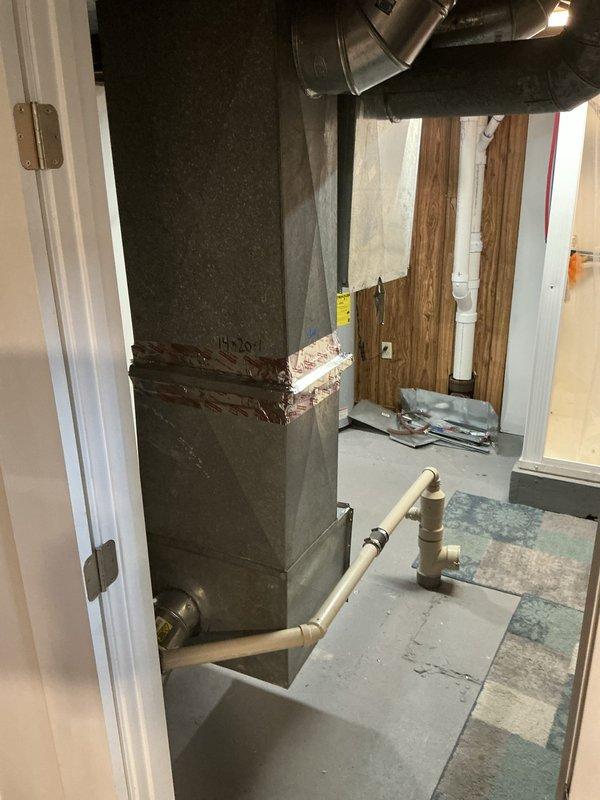 Conducted comprehensive assessment of existing 16-year-old Goodman HVAC system with air conditioning unit depleted of R22 refrigerant and previously installed furnace removed due to defective operation and unresolved warranty issues. Evaluated rooftop PVC vent assembly and interior ductwork configuration in basement utility space to determine scope of work for potential replacement of one or two complete HVAC systems.