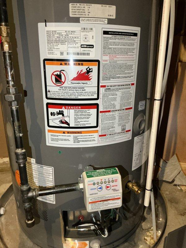 Responded to service call for water heater experiencing intermittent shutdowns and lockouts occurring every other day, though unit continued producing hot water between episodes. Upon arrival, conducted visual inspection and documented unit condition with photographs showing gas-fired water heater with standard safety labels and LED diagnostic display panel. Reviewed LED status code chart on control panel to assess potential fault codes. Inspected combustion air inlet openings for proper clearance and verified adequate ventilation. Examined gas control valve, thermocouple, and ignition system components for signs of malfunction. Checked electrical connections at 120V control board and verified proper amperage draw. Assessed flue venting system and confirmed proper draft operation. Unit age and manufacturer information could not be determined from available data plate information. Documented all findings and provided customer with contact information for follow-up.