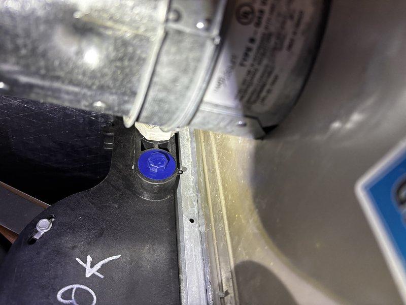 Responded to water leak concern on Carrier air conditioning system. Upon inspection, found unit still cooling properly despite reported leakage. Examined condensate drain system and refrigerant connections on outdoor unit. Documented equipment components including service ports, capacitor, and refrigerant labeling showing R-454B A2L refrigerant type with leak detection system requirements. Verified all connection points and mounting hardware for proper sealing. Unit operational at time of service call.