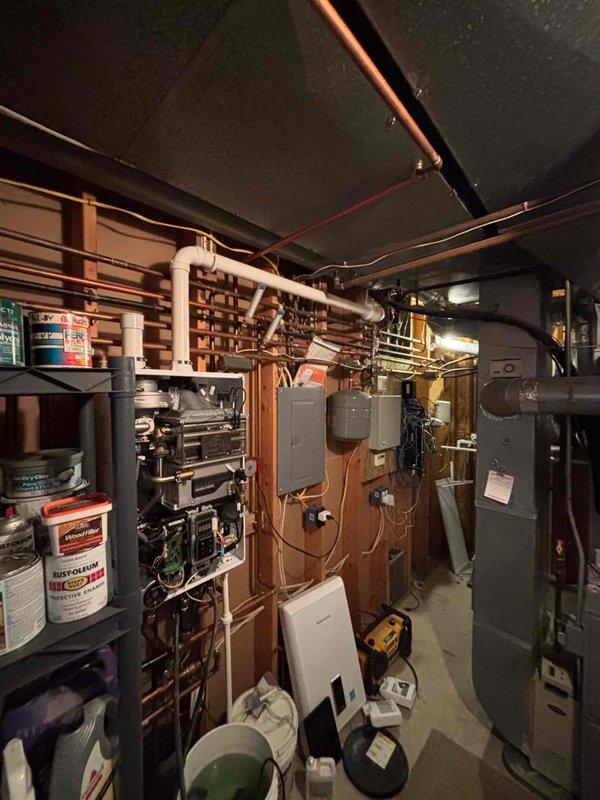 Responded to no hot water complaint on 5-year-old tankless water heater. Upon arrival, performed diagnostic evaluation and determined unit required descaling maintenance due to mineral buildup affecting heat exchanger performance. Flushed system using descaling solution circulated through heat exchanger via service pump and isolation valves. Completed full descaling procedure, restored unit to proper operation, and verified hot water delivery throughout home. Unit tested and left in working condition.