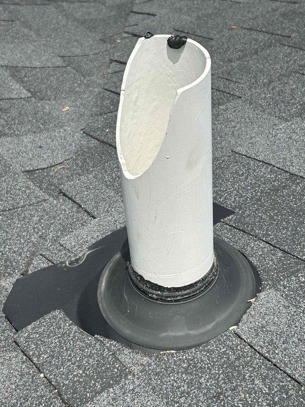 Responded to service call for damaged plumbing vent stack on north side of roof. Upon inspection, found missing section of PVC vent pipe above roof line. Replaced damaged upper section with new white PVC pipe, ensuring proper connection to existing lower section and verifying secure seal with rubber boot flashing at roof penetration. Vent stack restored to full functionality with proper venting capability maintained.