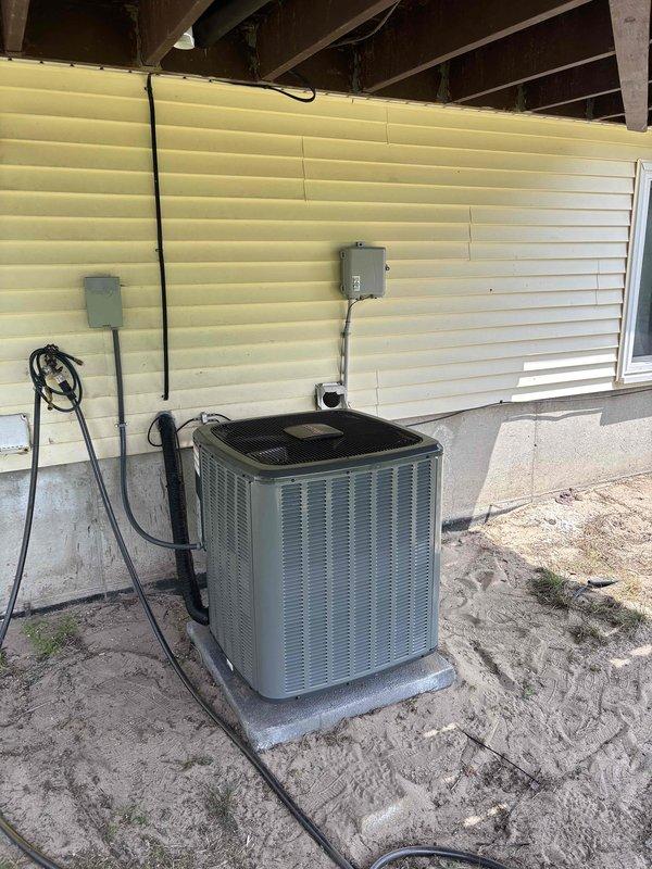 Completed full HVAC system installation including new furnace and air conditioning condenser unit. Installed outdoor AC condenser on concrete pad beneath elevated structure with proper electrical connections, conduit, and wiring routed to wall-mounted junction boxes. Interior furnace installation performed in mechanical closet with complete PVC venting system, including multiple elbows and proper termination. Integrated ductwork connections to existing metallic supply plenum and installed wall-mounted humidifier unit with corresponding ductwork and filtration. All copper refrigerant lines connected between indoor and outdoor units. Electrical service completed for both furnace and condenser with appropriate disconnect boxes. System tested for proper operation and airflow. Certificate of Completion documentation processed through electronic signature platform and submitted for financing approval through Michigan Saves program.
