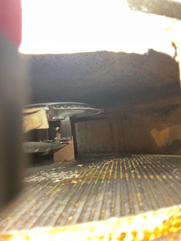Responded to emergency service call for leaking water heater in residential property. Upon arrival, confirmed active leak from 7-year-old unit and verified that homeowner had shut off power to the equipment as previously advised by emergency services technician. Conducted thorough inspection of water heater and surrounding plumbing infrastructure, including copper supply lines, PVC drainage system, and flue venting components. Documented existing conditions with photographs showing utility room layout, exposed piping systems, electrical connections, and internal water heater components including heat exchanger with visible corrosion and oxidation. Assessed severity of leak and determined unit required replacement due to age and extent of deterioration observed on internal metallic components.