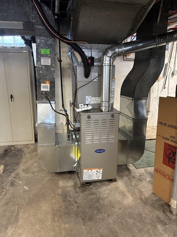 Completed full HVAC system installation in basement mechanical room, including new Carrier furnace unit and air conditioning system. Installed and connected all metal ductwork, plenums, and air handler components with proper sealing and support. Ran electrical conduit and wiring to furnace and auxiliary equipment, integrated humidifier system to furnace assembly, and verified all connections meet code requirements. System tested and operational upon completion.