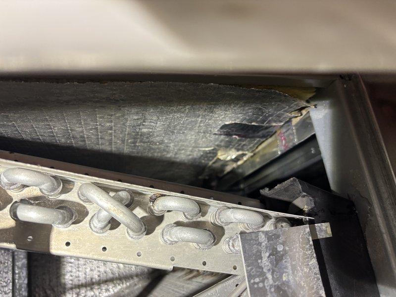 Responded to third service call for air conditioning system running continuously, requiring thermostat setting of 76°F to cycle off. Upon inspection, discovered significant disconnected ductwork in attic space, which was causing substantial conditioned air loss and preventing proper system cycling. Documented ductwork separation with photos showing metal duct connections pulled apart from mounting brackets and structural supports. Addressed customer concerns regarding previous capacitor diagnosis, confirming that disconnected ductwork was the primary issue affecting system performance rather than electrical components. Explained how air loss from separated ducts created continuous cooling demand, preventing thermostat satisfaction at normal temperature settings.