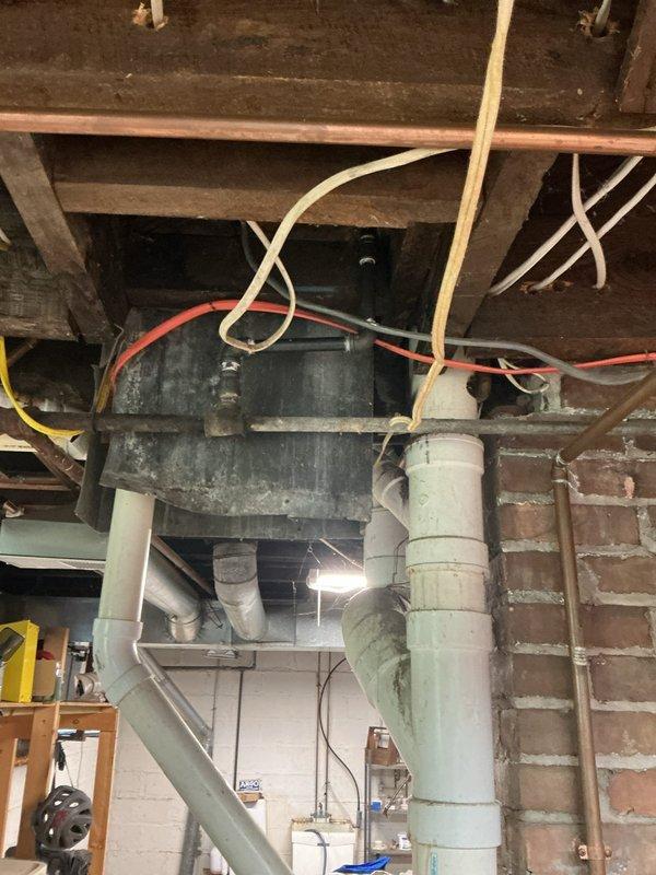 Installed shut-off valve on dedicated gas line to stove in basement utility area and prepared connection point for new stove installation. Work completed on copper gas piping system with all connections tested and verified for proper operation and safety.