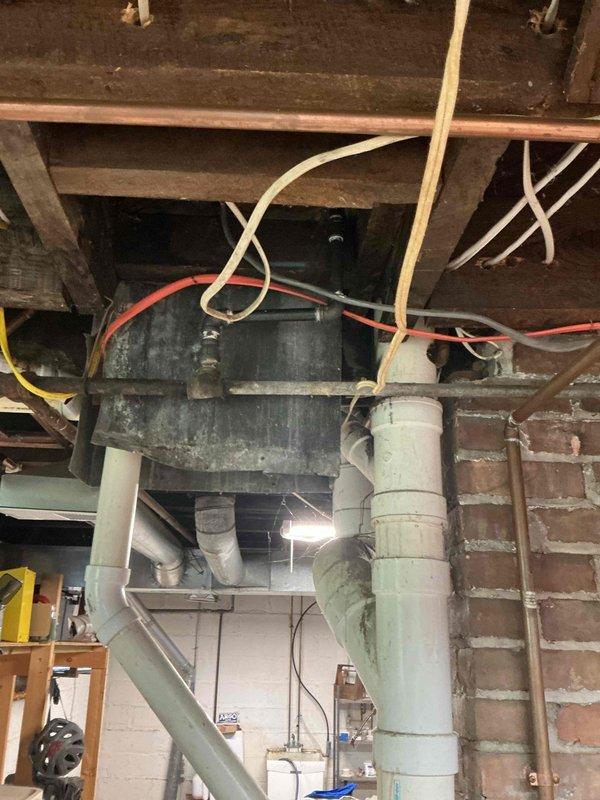 Installed shut-off valve on dedicated gas line to stove in basement utility area and prepared connection point for new stove installation. Work completed on copper gas piping system with all connections tested and verified for proper operation and safety.