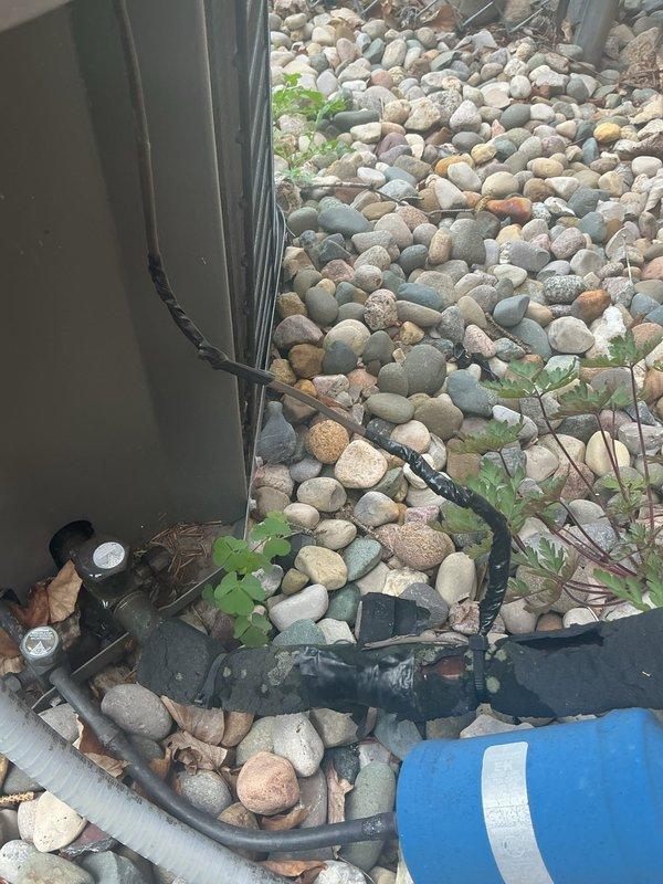 Responded to no heating or cooling call on 20-year-old Lennox system that was completely unresponsive. Upon arrival, performed systematic diagnostic of both heating and cooling components. Inspection of outdoor condenser unit revealed severely damaged low voltage control wiring with exposed conductors and compromised insulation. Wire damage appeared consistent with animal activity or environmental deterioration. Replaced damaged control wire section and verified all electrical connections at both indoor air handler and outdoor condensing unit. Restored power to system and confirmed proper operation of both heating and cooling modes. Tested thermostat communication and verified all safety controls functioning correctly. Discussed humidifier operation with homeowner per previous technician notes regarding slow-draining floor drain that backs up with excessive water flow. Recommended keeping humidifier off until drainage issue is resolved to prevent water damage. System operational at tim