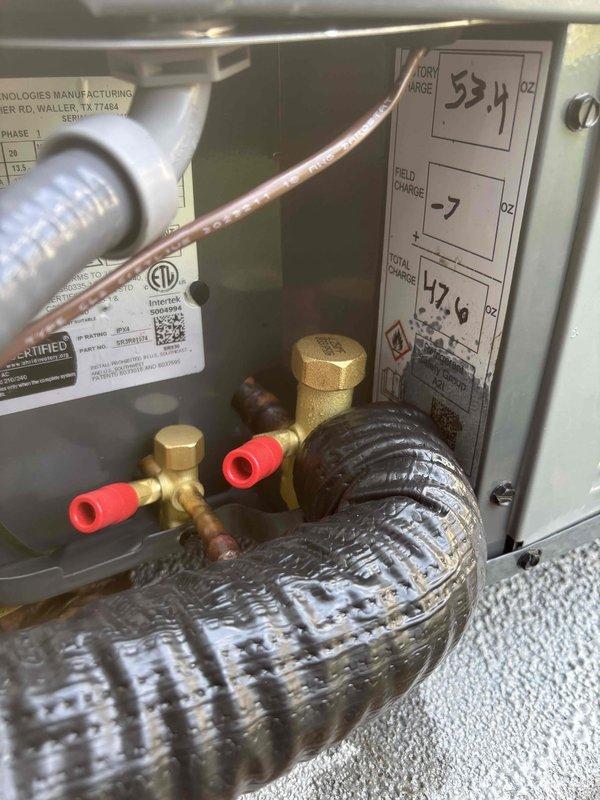 Completed full air conditioning system replacement at residential property. Installed new outdoor condenser unit on existing concrete pad with proper refrigerant line connections and electrical disconnect. Performed field charging of refrigerant system with 7 ounces added to manufacturer specifications for total system charge of 42.6 ounces. Verified all service valves, copper line connections, and system components properly installed and operational. System tested and confirmed functioning within normal operating parameters.