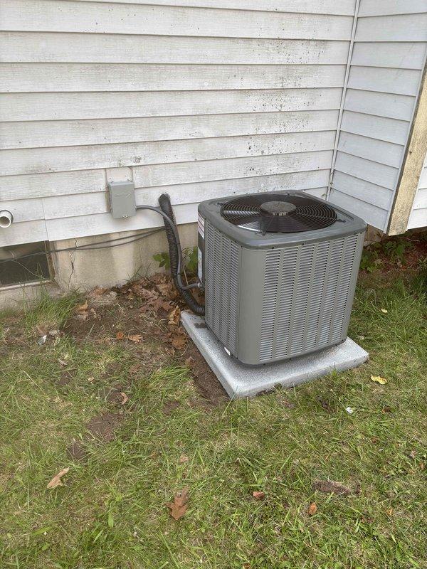 Completed full air conditioning system replacement at residential property. Installed new outdoor condenser unit on existing concrete pad with proper refrigerant line connections and electrical disconnect. Performed field charging of refrigerant system with 7 ounces added to manufacturer specifications for total system charge of 42.6 ounces. Verified all service valves, copper line connections, and system components properly installed and operational. System tested and confirmed functioning within normal operating parameters.