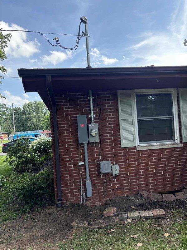 Completed 150-amp electrical service upgrade at residential property. Coordinated utility company disconnect and reconnect service, obtained electrical permit, and installed new exterior meter panel with weatherhead mast and conduit on brick exterior wall. Upgraded interior main electrical panel with new circuit breaker configuration, ran necessary feeder wiring through ceiling cavity, and ensured all connections met current electrical code requirements. Work passed municipal electrical inspection upon completion, and power was successfully restored to the property.
