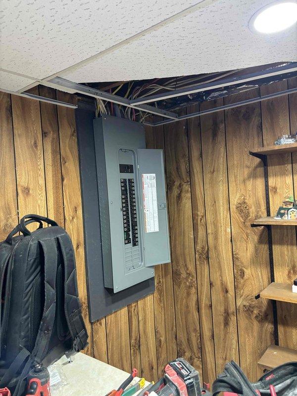 Completed 150-amp electrical service upgrade at residential property. Coordinated utility company disconnect and reconnect service, obtained electrical permit, and installed new exterior meter panel with weatherhead mast and conduit on brick exterior wall. Upgraded interior main electrical panel with new circuit breaker configuration, ran necessary feeder wiring through ceiling cavity, and ensured all connections met current electrical code requirements. Work passed municipal electrical inspection upon completion, and power was successfully restored to the property.