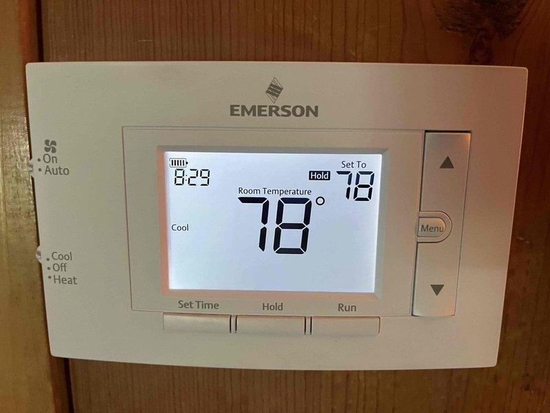Completed annual cooling maintenance on residential AC system under 2-year EnergiAir warranty agreement. Performed comprehensive tune-up including refrigerant level check and adjustment, verified thermostat operation showing proper cooling mode function at 78°F setpoint, inspected outdoor condenser unit for proper airflow and component condition, and documented system performance with photos. All equipment operating within normal parameters upon completion.