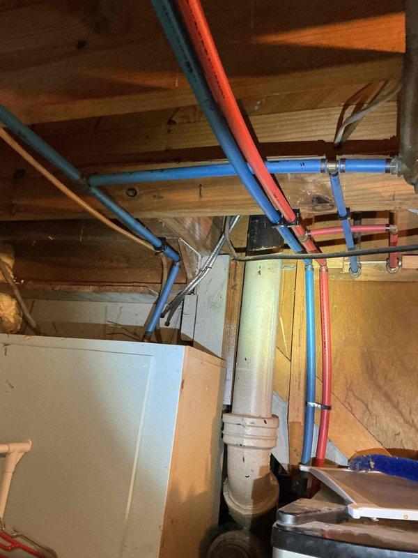 Conducted water quality assessment and site evaluation for potential water filtration system installation. Documented existing plumbing infrastructure in basement utility area, including PEX hot and cold water supply lines, routing configurations, and available installation points for filtration equipment. Trip charge waived per management approval, with client considering supply of their own filtration system for professional installation.