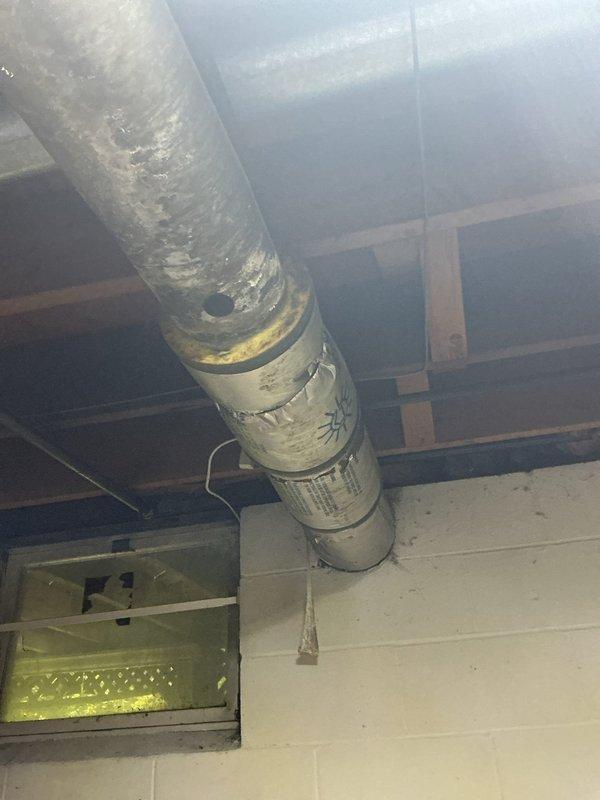 Responded to water leak caused by damaged insulation on air conditioning refrigerant line set at point of entry into home. Inspected basement area where condensation was dripping from torn insulation on line set, confirmed active water intrusion inside dwelling. Documented damaged insulation and leak point with photos, verified HVAC system continues to operate normally for heating and cooling despite insulation compromise.