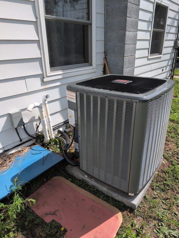 Completed full air conditioning system replacement at residential property. Removed existing outdoor condensing unit and installed new unit on concrete pad adjacent to house exterior with proper refrigerant line connections through exterior wall. Verified customer identification, secured financing approval for same-day installation, and completed all work within scheduled timeframe with system operational upon departure.
