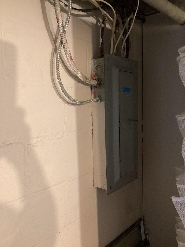 Completed estimate for new air conditioning system installation in property with no existing AC equipment. Assessed existing electrical panel and infrastructure to determine requirements for adding electrical subpanel necessary to support new AC system load. Documented current electrical configuration and available capacity for planned installation.