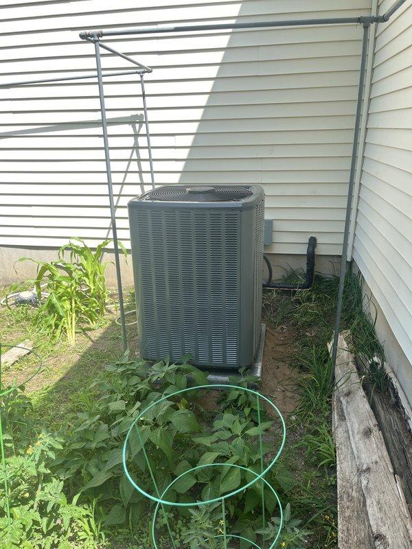 Completed full HVAC system replacement including installation of new furnace unit and outdoor condensing unit. Indoor equipment installed in basement utility area with proper electrical connections, control panel integration, and PVC condensate drainage piping. Outdoor condenser positioned against exterior wall on existing pad with refrigerant line connections completed. All electrical connections verified, system charged to manufacturer specifications, and full operational testing performed to confirm proper heating and cooling functionality. Equipment installation meets code requirements with appropriate clearances maintained for service access and airflow.