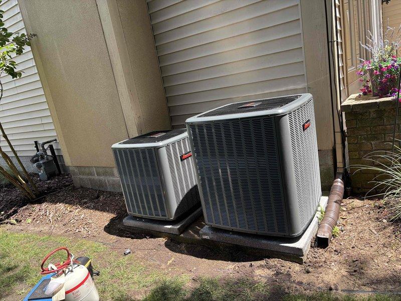 Completed full replacement of two Unico high-velocity air conditioning systems at residential property. Removed existing units and installed two new outdoor condenser units on rubber isolation pads against exterior wall with proper clearances maintained. Installed electrical disconnects with weatherproof conduit routing to each unit, mounted condensers on level concrete pads, and verified all refrigerant lines, electrical connections, and drainage systems were properly secured and operational. System startup performed on both units with successful operational testing confirming proper cooling performance and airflow throughout the home.