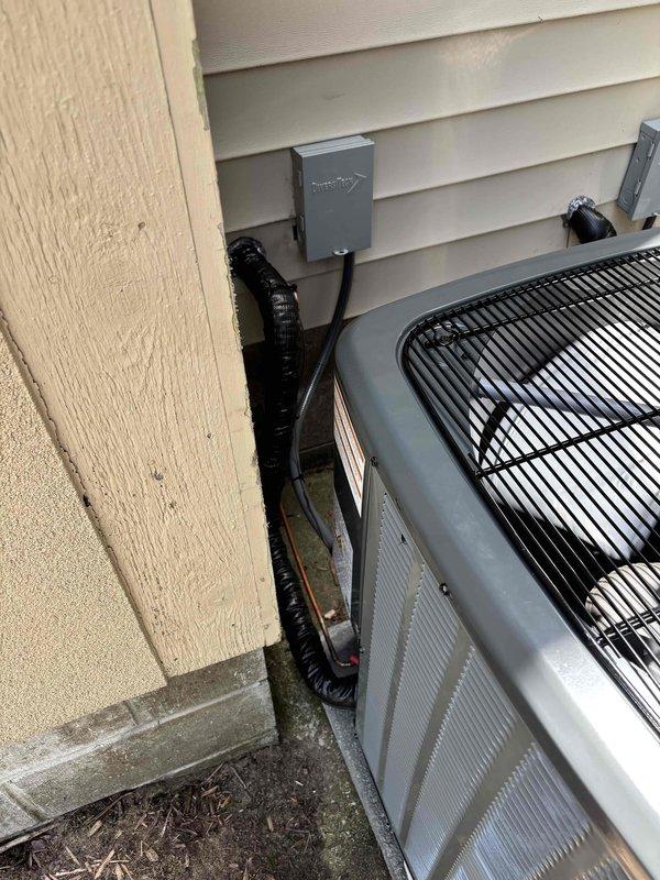 Completed full replacement of two Unico high-velocity air conditioning systems at residential property. Removed existing units and installed two new outdoor condenser units on rubber isolation pads against exterior wall with proper clearances maintained. Installed electrical disconnects with weatherproof conduit routing to each unit, mounted condensers on level concrete pads, and verified all refrigerant lines, electrical connections, and drainage systems were properly secured and operational. System startup performed on both units with successful operational testing confirming proper cooling performance and airflow throughout the home.