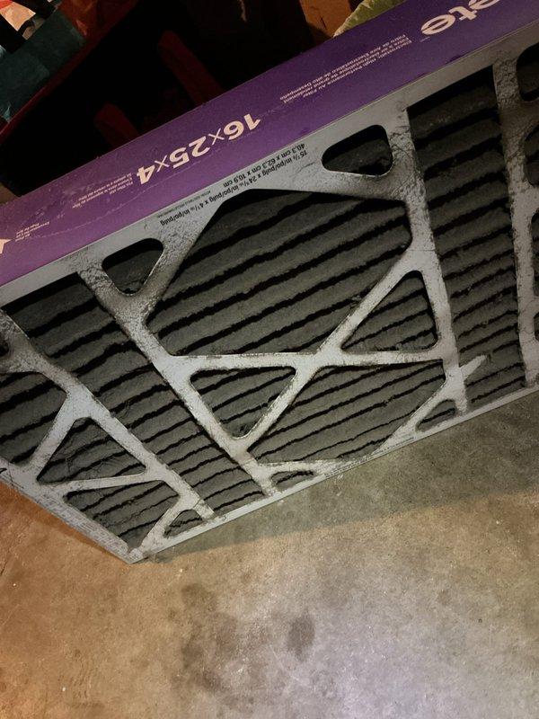 Responded to cooling complaint on 15-year-old air conditioning system not performing as effectively as in previous years. Upon inspection, discovered heavily soiled 16x25x4 pleated air filter with significant dust and debris accumulation restricting airflow through the HVAC system. Replaced dirty filter with new unit to restore proper airflow and system efficiency. System operational upon completion of service.