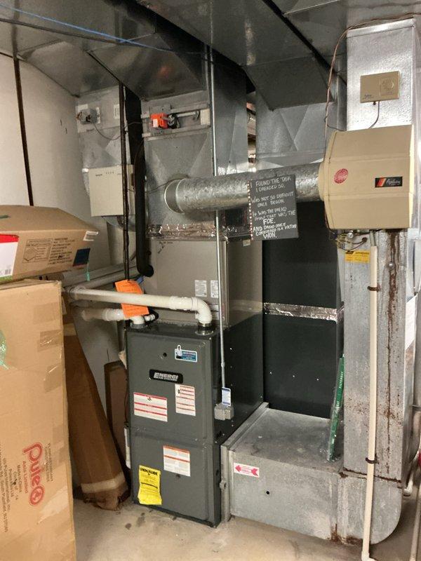 Responded to no-cool complaint on upstairs air conditioning unit affecting entire home. Accessed equipment through service door to garage with no one home. Inspected 5-year-old EnergiAir system located in basement utility area alongside furnace and ductwork. Documented equipment condition with photos showing HVAC system, ductwork connections, and surrounding mechanical room. Diagnosed issue with smaller capacity unit responsible for cooling upper level of residence. Completed necessary repairs to restore cooling function and verified system operation. Provided wrap-up call to homeowner as requested to confirm service completion and system restoration.