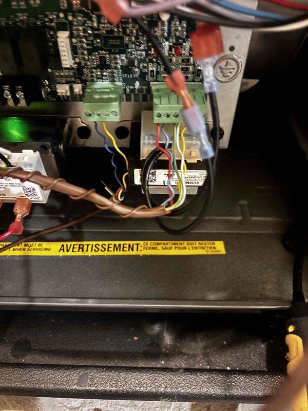 Responded to no-cooling complaint on EnergiAir system installed last winter. Upon arrival, confirmed AC compressor not running when thermostat set to cooling mode. Inspected control board and found faulty relay preventing compressor contactor from engaging. Tested voltage at terminal blocks and verified proper 24V control signal from thermostat. Replaced defective relay on control board and confirmed all wire connections secure at terminal blocks. Cycled system through multiple cooling cycles to verify compressor operation and proper system function. Checked circuit breakers in main panel for proper connection and confirmed no tripping issues. System now cooling properly throughout home with compressor engaging on call for cooling.