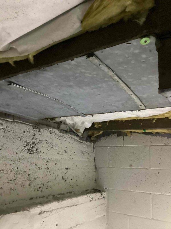 # NOISE-Noise Problem Resolution

Responded to service call for loud banging noise from newly installed Carrier furnace causing floors to shake. Accessed property using provided key code and inspected unit while running. Upon investigation, identified inadequate vibration isolation and improper mounting of ductwork connections to floor joists. Secured loose ductwork hangers and added vibration dampening supports at critical connection points where metal ductwork meets structural framing. Verified all mounting hardware was properly tightened and adjusted clearances between ductwork and building structure to eliminate contact points. Observed unit through multiple heating cycles to confirm elimination of banging noise and vibration transmission to floors. Documented installation conditions with photos showing ductwork configuration and mounting points in basement utility area. Completed wrap-up call as requested to confirm resolution of noise issue.
