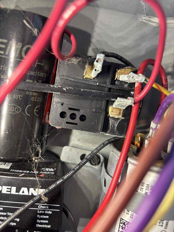 # Cooling System Repair - No Outdoor Unit Operation

Responded to service call for non-operational outdoor condensing unit while indoor furnace fan was running normally. Upon inspection of outdoor unit electrical components, discovered severely damaged wire insulation on low voltage control wiring leading to contactor assembly. Wire showed signs of thermal damage with melted, deteriorated insulation that compromised electrical connectivity and prevented contactor energization.

Replaced damaged control wiring and verified proper electrical connections at contactor terminals. Tested system operation and confirmed outdoor unit now engages properly when thermostat calls for cooling. All electrical connections secured and system returned to normal operation.