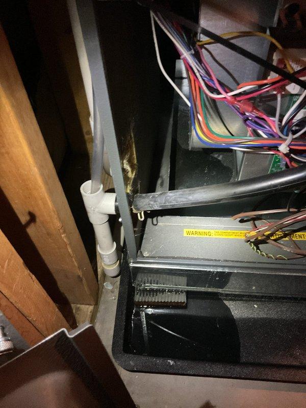 Responded to no cooling call on system installed approximately one year ago. Found unit completely inoperable with continuous water leakage into drain pan despite system being off. Upon inspection, discovered severe corrosion on evaporator coil and drain pan assembly, indicating premature failure. Documented extensive rust damage to mounting hardware and heat exchanger components. System requires evaporator coil replacement and drain pan assembly due to corrosion beyond serviceable limits.