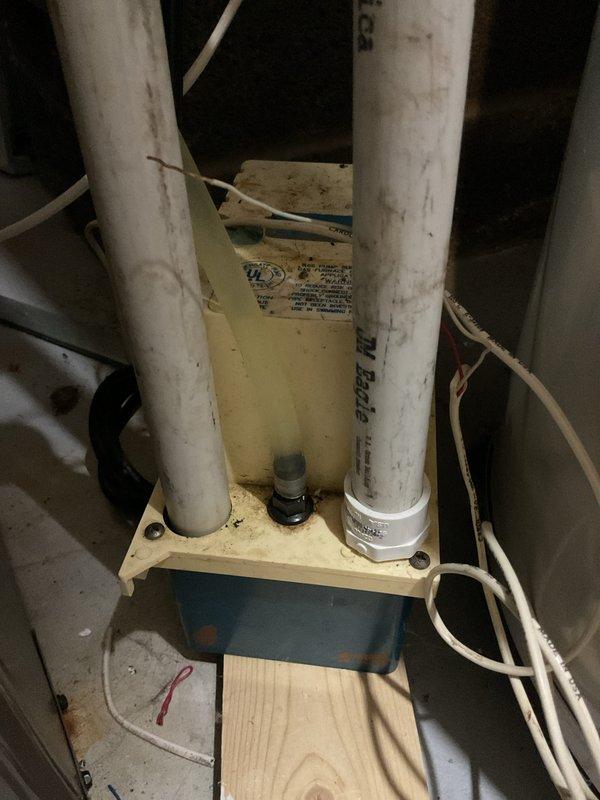 Completed annual cooling maintenance on 15-year-old AC system. Performed standard inspection of condensate drain system and trap assembly, verified proper drainage and documented equipment condition with photos showing normal moisture accumulation in drain pan. All components operating within normal parameters, system cleared for continued operation with customer maintenance due in 2026.