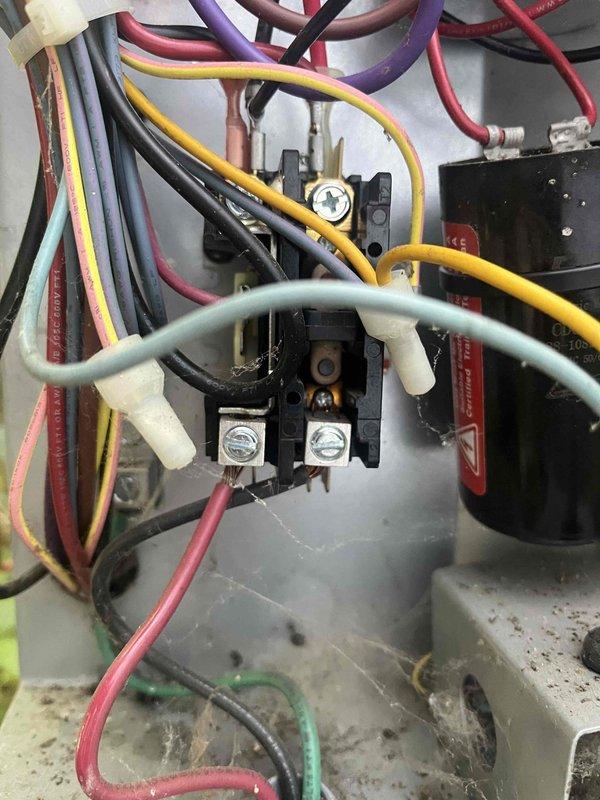 Completed annual cooling maintenance on 2019 EnergiAir unit with warranty through June 2029. Inspected and replaced faulty contactor relay showing signs of wear and discoloration on contact terminals. Verified all electrical connections at terminal blocks, checked wire integrity across control circuits, and confirmed proper operation of system components following contactor replacement.
