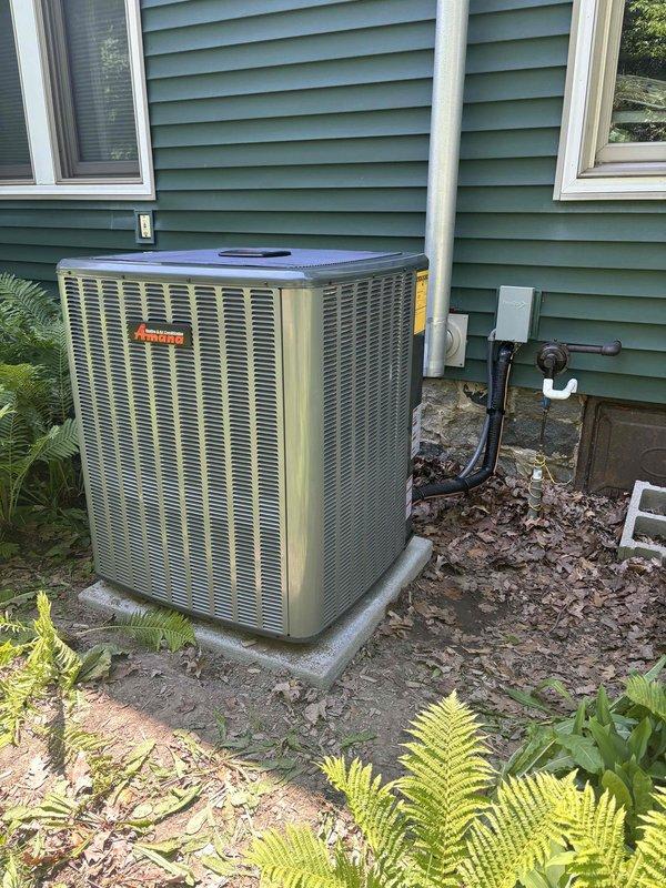 Successfully completed full HVAC system installation including furnace and air conditioning unit. Installed outdoor condenser unit on concrete pad with proper refrigerant line connections, electrical conduit, and condensate drain routing secured to exterior wall. System commissioned and tested with pressure readings confirmed within manufacturer specifications for R-410A refrigerant, verifying proper charge and operational performance of the split system cooling equipment.