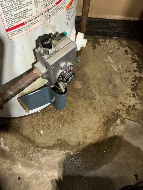 Responded to no cooling complaint on 2-year-old Payne air conditioning system. Upon arrival, discovered images documented water heater and plumbing components in mechanical space rather than AC equipment. Unable to diagnose or service air conditioning unit as AC system was not accessible or photographed during this visit.