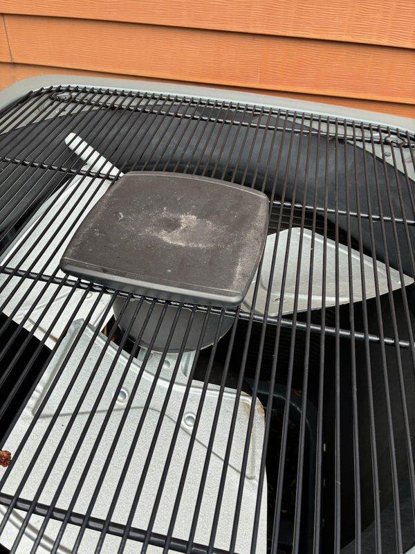 Completed annual cooling maintenance on 2021 EnergiAir air conditioning system. Addressed issue with top cap that had blown off unit due to wind damage. Inspected condenser unit, secured protective grille cover, and reinstalled top access panel. Performed standard AC tune-up procedures including system inspection and operational verification. Unit returned to normal operating condition with all protective covers properly secured.