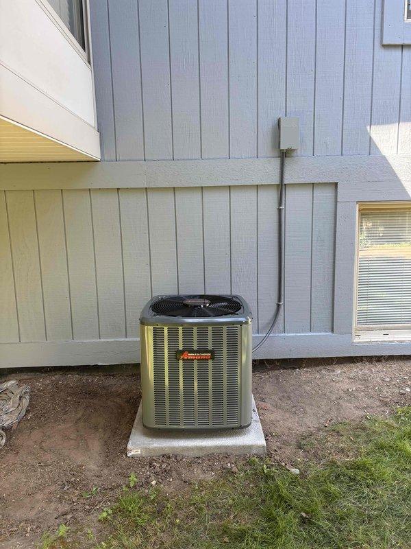 Completed full air conditioning system replacement at residential property. New outdoor condensing unit installed on existing concrete pad with proper electrical connections and refrigerant lines. System charged with R-32 refrigerant and verified proper operation with superheat readings at 24°, matching manufacturer specifications for optimal performance and efficiency.