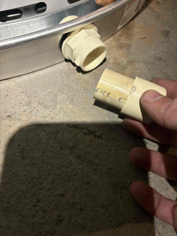 Completed comprehensive AC tune-up on 9-year-old system. Inspected and serviced condensate drain line components, including PVC fittings and drain trap assembly. All system components operating within normal parameters, no issues identified during inspection.