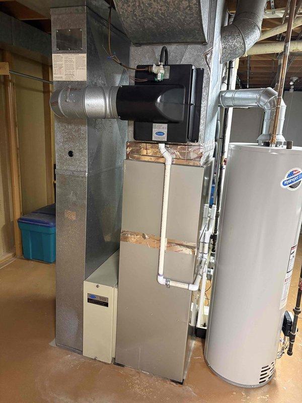Responded to no-cooling complaint on 12-year-old residential air conditioning system running continuously with indoor temperature at 79°F despite thermostat set to 71°F. Upon arrival, conducted comprehensive system evaluation including inspection of indoor furnace/air handler unit and associated ductwork in basement mechanical room. Verified system operation, checked refrigerant levels, inspected electrical connections, and tested thermostat functionality. Assessed condenser unit performance and airflow through evaporator coil. System had not received professional maintenance since 2012. Identified root cause of cooling deficiency and performed necessary repairs to restore proper operation. Verified system cycling correctly and achieving target temperature setpoint. Unit returned to normal operating parameters with adequate cooling capacity restored prior to client's scheduled departure.