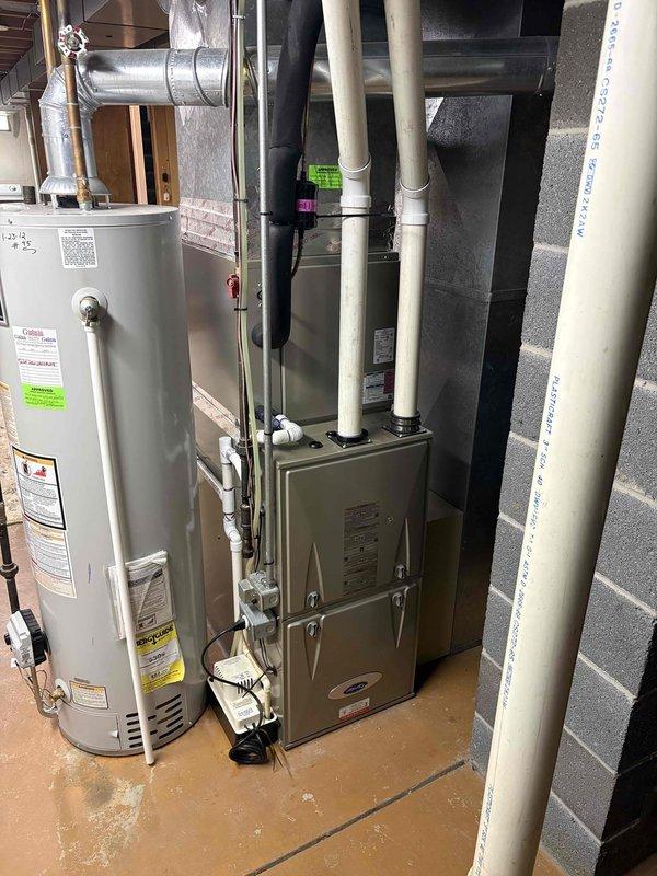 Responded to no-cooling complaint on 12-year-old residential air conditioning system running continuously with indoor temperature at 79°F despite thermostat set to 71°F. Upon arrival, conducted comprehensive system evaluation including inspection of indoor furnace/air handler unit and associated ductwork in basement mechanical room. Verified system operation, checked refrigerant levels, inspected electrical connections, and tested thermostat functionality. Assessed condenser unit performance and airflow through evaporator coil. System had not received professional maintenance since 2012. Identified root cause of cooling deficiency and performed necessary repairs to restore proper operation. Verified system cycling correctly and achieving target temperature setpoint. Unit returned to normal operating parameters with adequate cooling capacity restored prior to client's scheduled departure.