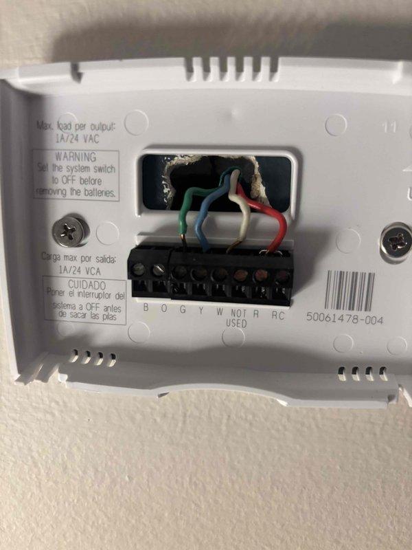 Responded to no cooling call on 13-year-old system with outdoor unit not operating. Upon arrival, inspected thermostat wiring and connections at wall-mounted unit, verifying proper wire terminations at designated terminals (R, RC, G, Y, W, O/B). Examined attic space where HVAC ductwork and electrical wiring are located, checking wire connections secured with wire nuts and cable ties along main trunk line. Confirmed all electrical connections were properly secured and junction points were intact. Troubleshot system operation and restored cooling functionality to unit.