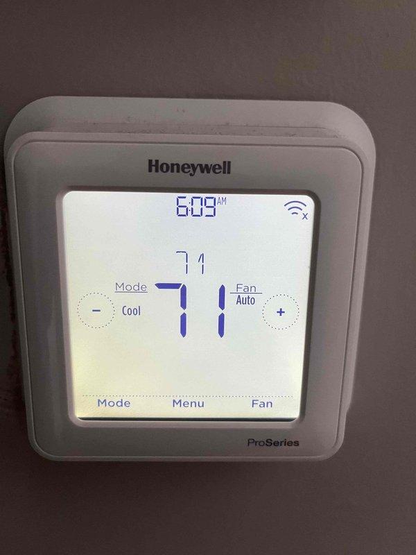 Completed annual cooling maintenance on EnergiAir system. Performed comprehensive tune-up including inspection of outdoor condensing unit, refrigerant lines, and Honeywell ProSeries programmable thermostat. Verified thermostat operation in cooling mode with fan set to auto, confirmed WiFi connectivity, and ensured proper temperature control at 71°F setpoint. Inspected outdoor unit installation, checked refrigerant line insulation integrity, and verified proper drainage in mulched service area. All components operating within normal parameters. System ready for cooling season.
